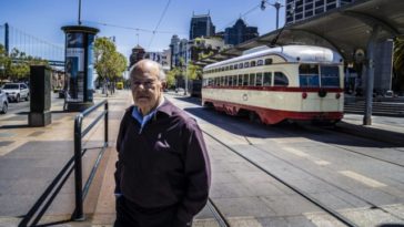 man on tram tracks